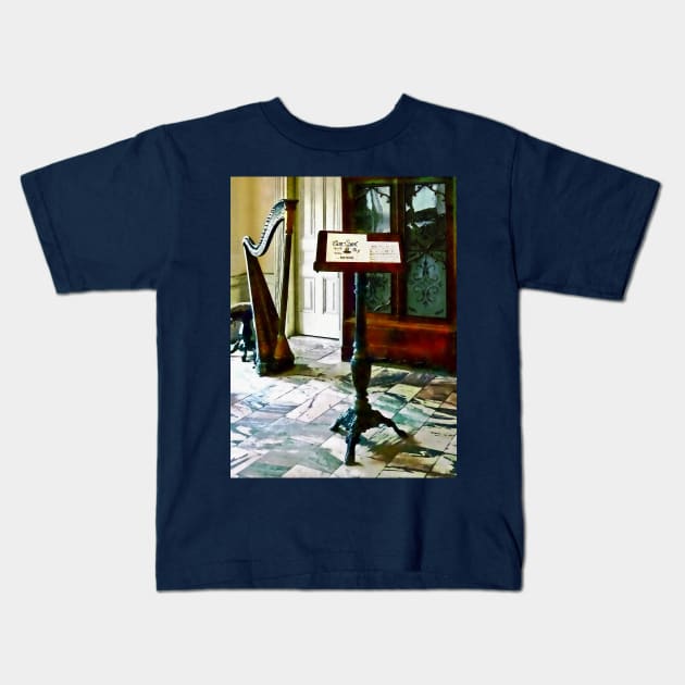 Music - Music Room With Harp Kids T-Shirt by SusanSavad